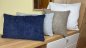 Preview: Dekokissen Kama blau hellgrau weiß und hellbraun auf Bank